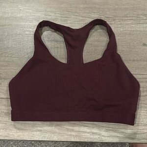Wine colored fabletics sports bra.